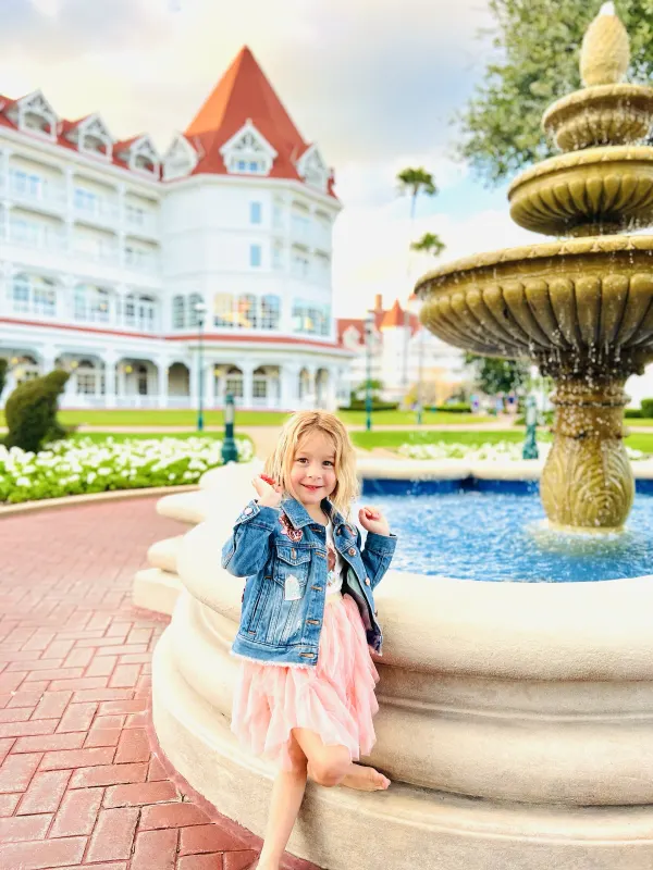 The signature white-and-red Victorian tower above the front courtyard fountain — the architectural shot every guest takes on arrival day.