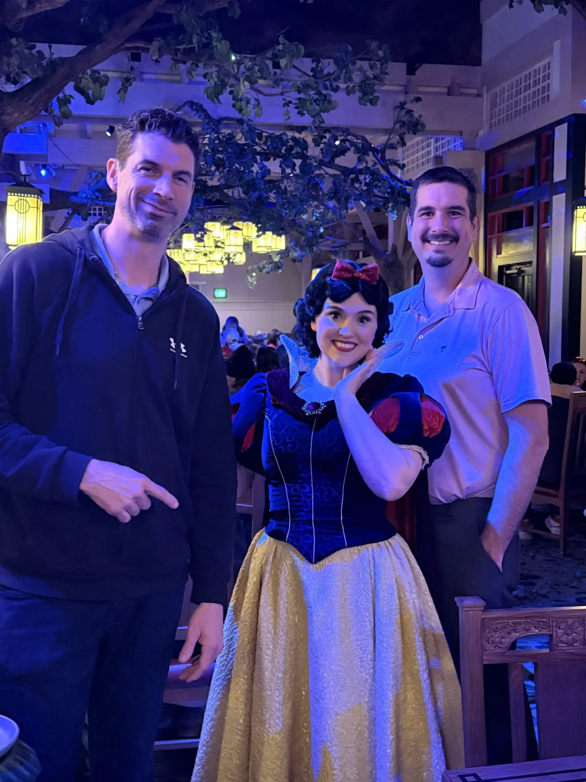 Snow White visits each table in the enchanted-forest dining room at Artist Point — the meet happens between courses, no line.