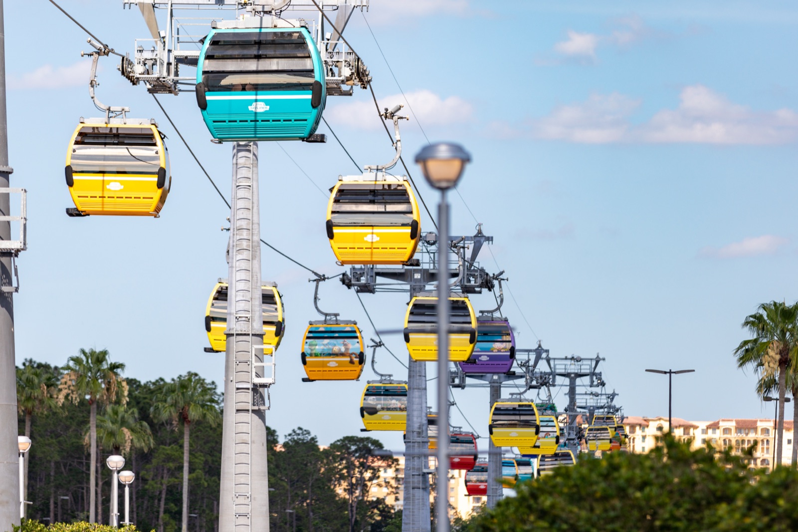 The Skyliner gondolas leaving the EPCOT International Gateway station, en route to Hollywood Studios and the resorts.